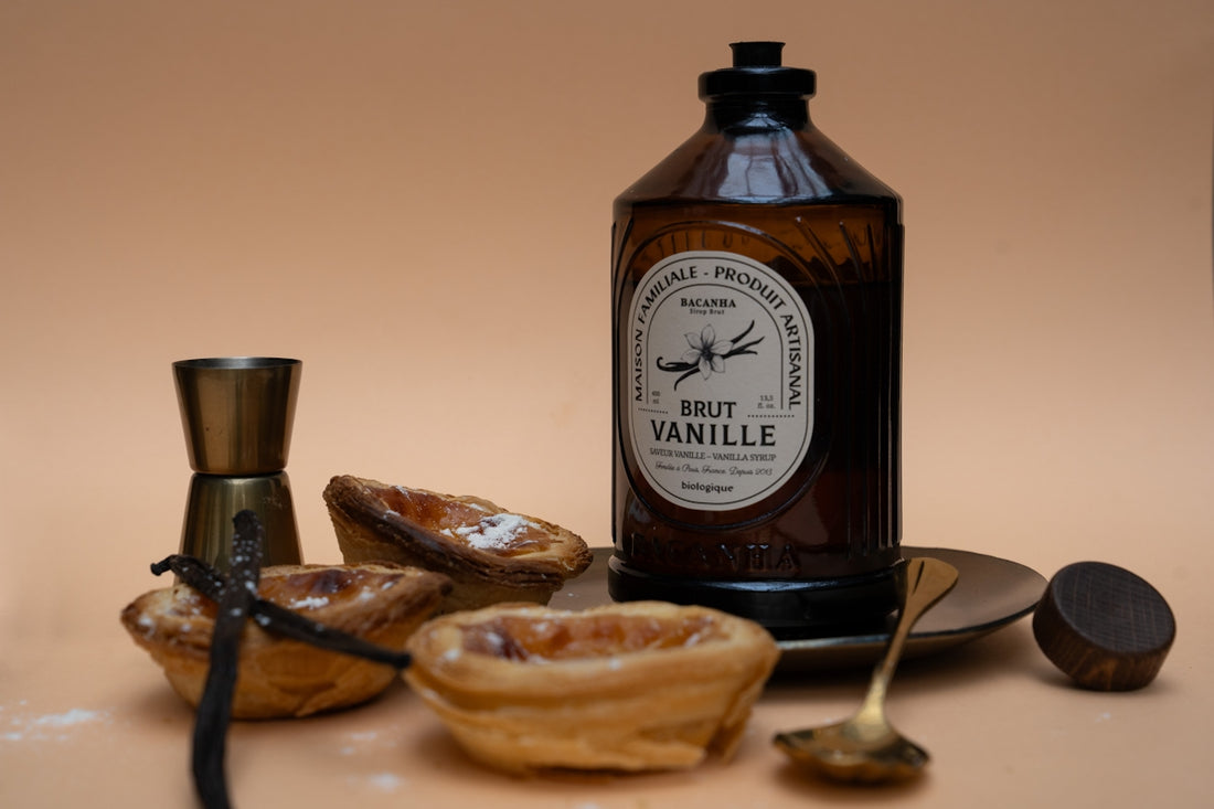 Vanilla flavoring and pastries are artistically arranged.